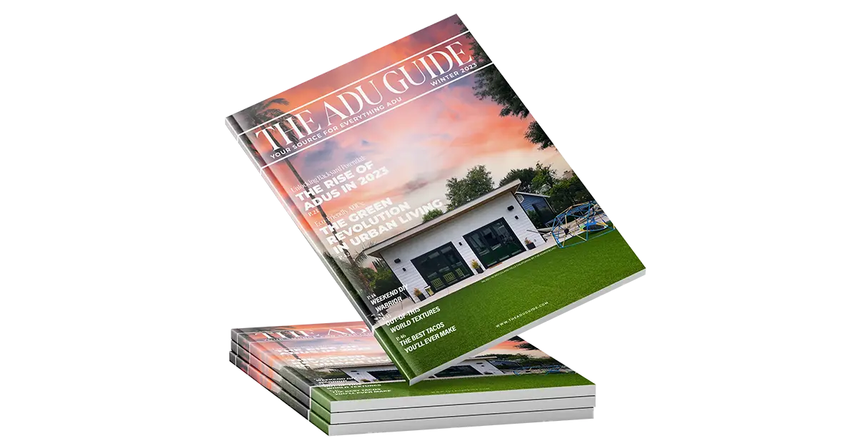 The ADU Guide magazine cover featuring a modern accessory dwelling unit with a sunset background and lush green lawn.