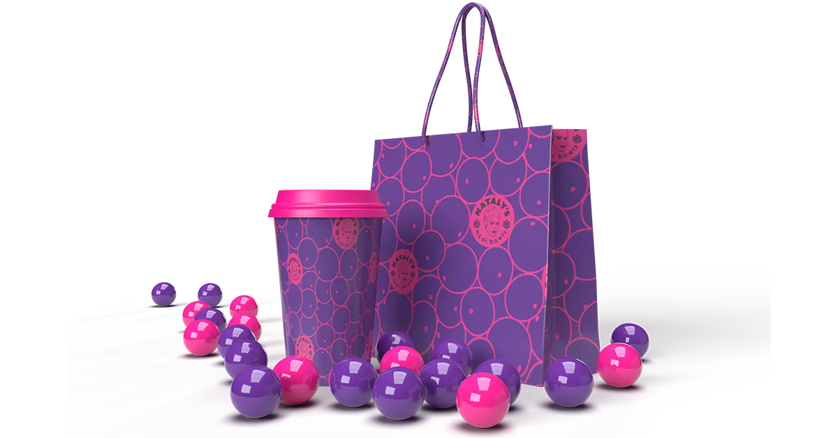 Purple and pink branded packaging with a dotted pattern for Nataly’s Acai, accompanied by playful decorative elements.