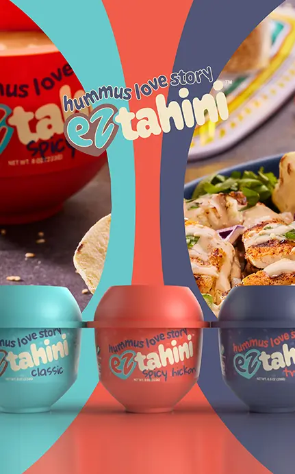 Colorful packaging lineup for EZ Tahini featuring different flavors in teal, red, and navy containers.